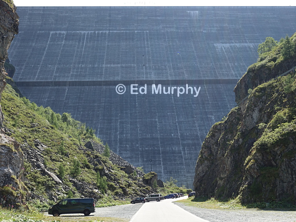 The Grande Dixence dam wall. Note the figures on the crest at the extreme right
