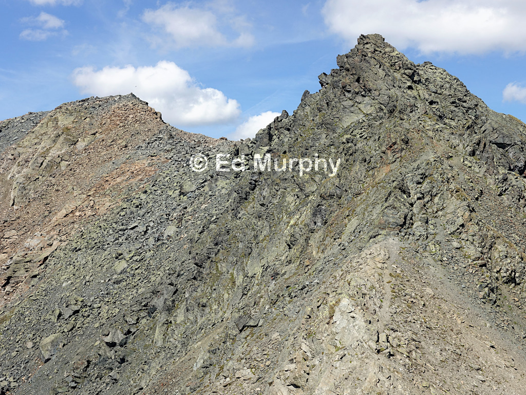 The way to Piz Cotschen's summit (L) from the forepeak