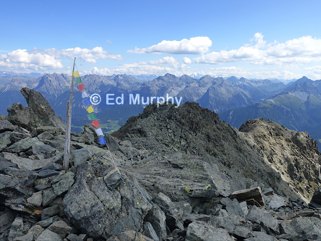 The middle peak and forepeak of Piz Cotschen from the summit