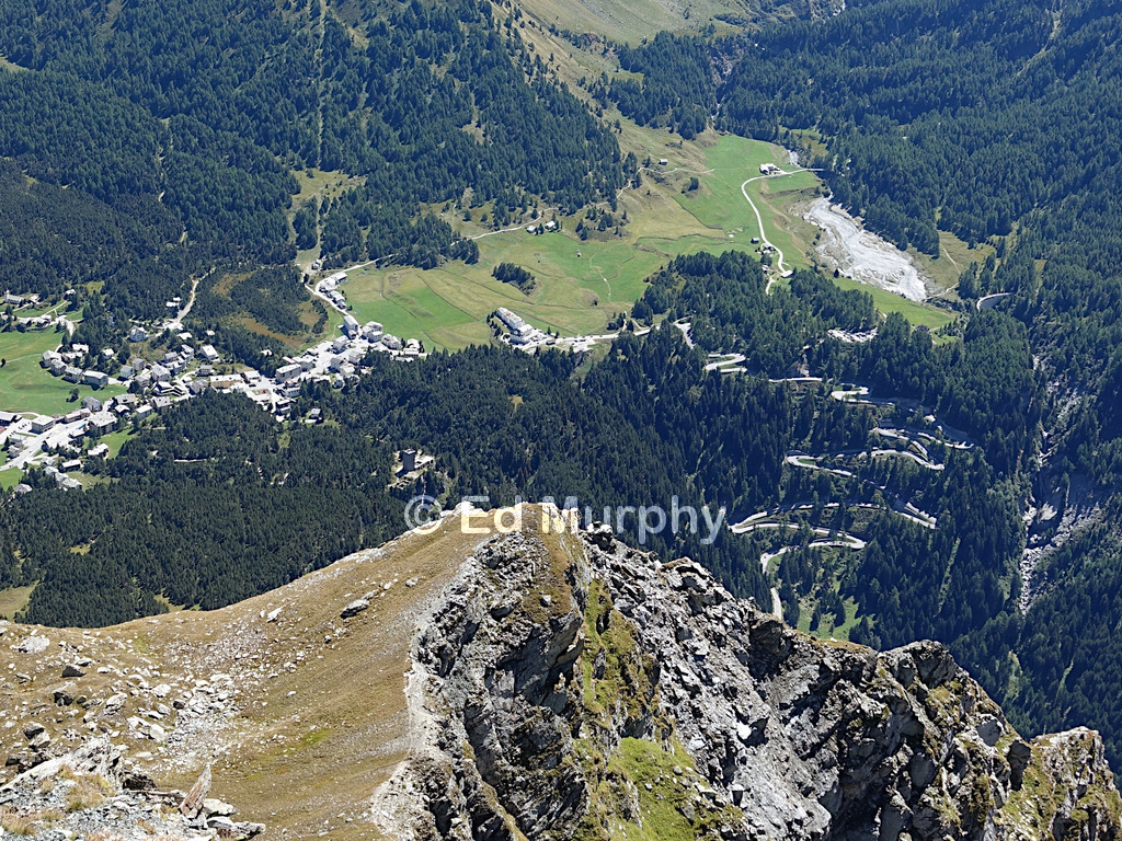Maloja Village and the Maloja Pass hairpins from the summit of Piz Lunghin