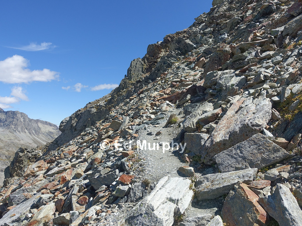 A steep part of the track below the summit of Piz Lunghin