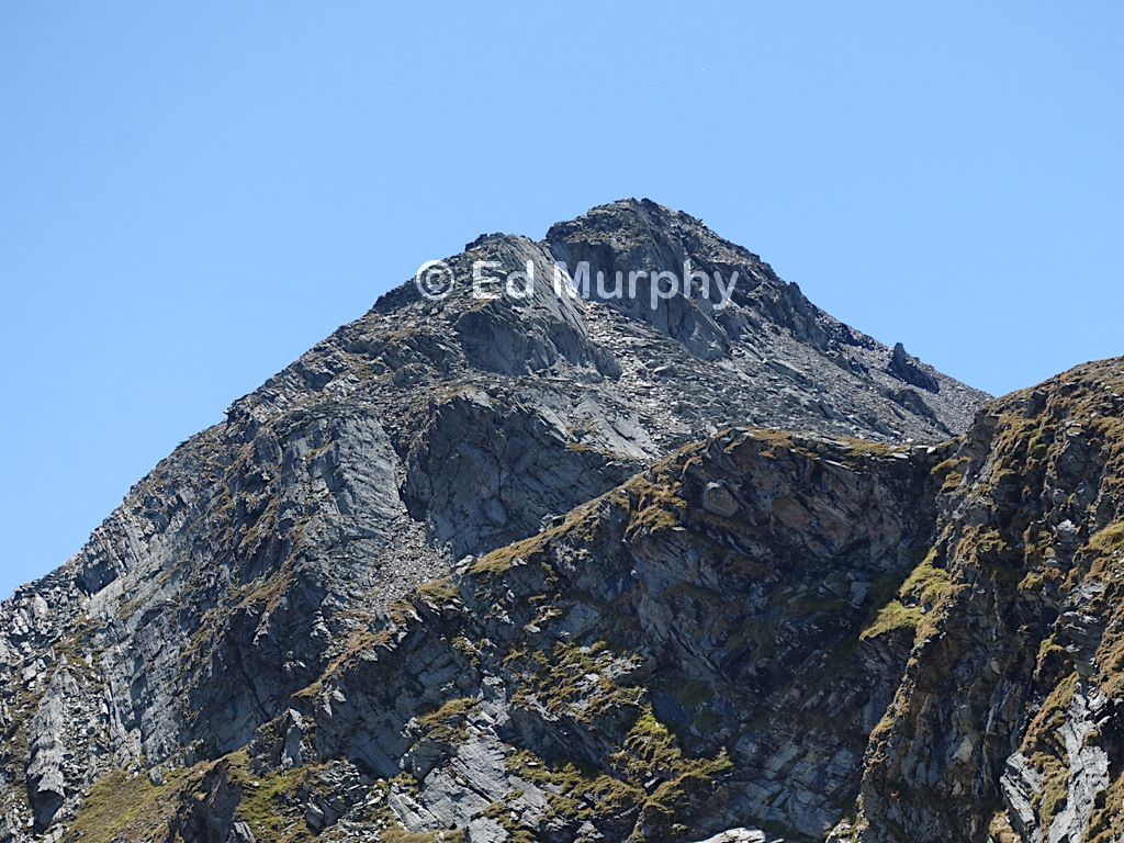 Piz Lunghin's summit seen from the lake of the same name